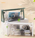 Green and white clear triangular zipper pencil cases stacked diagonally with stationery inside