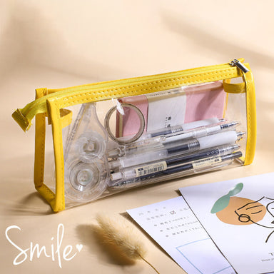 Lemon yellow trim clear triangular pencil case filled with gel pens, tape and sticky notes