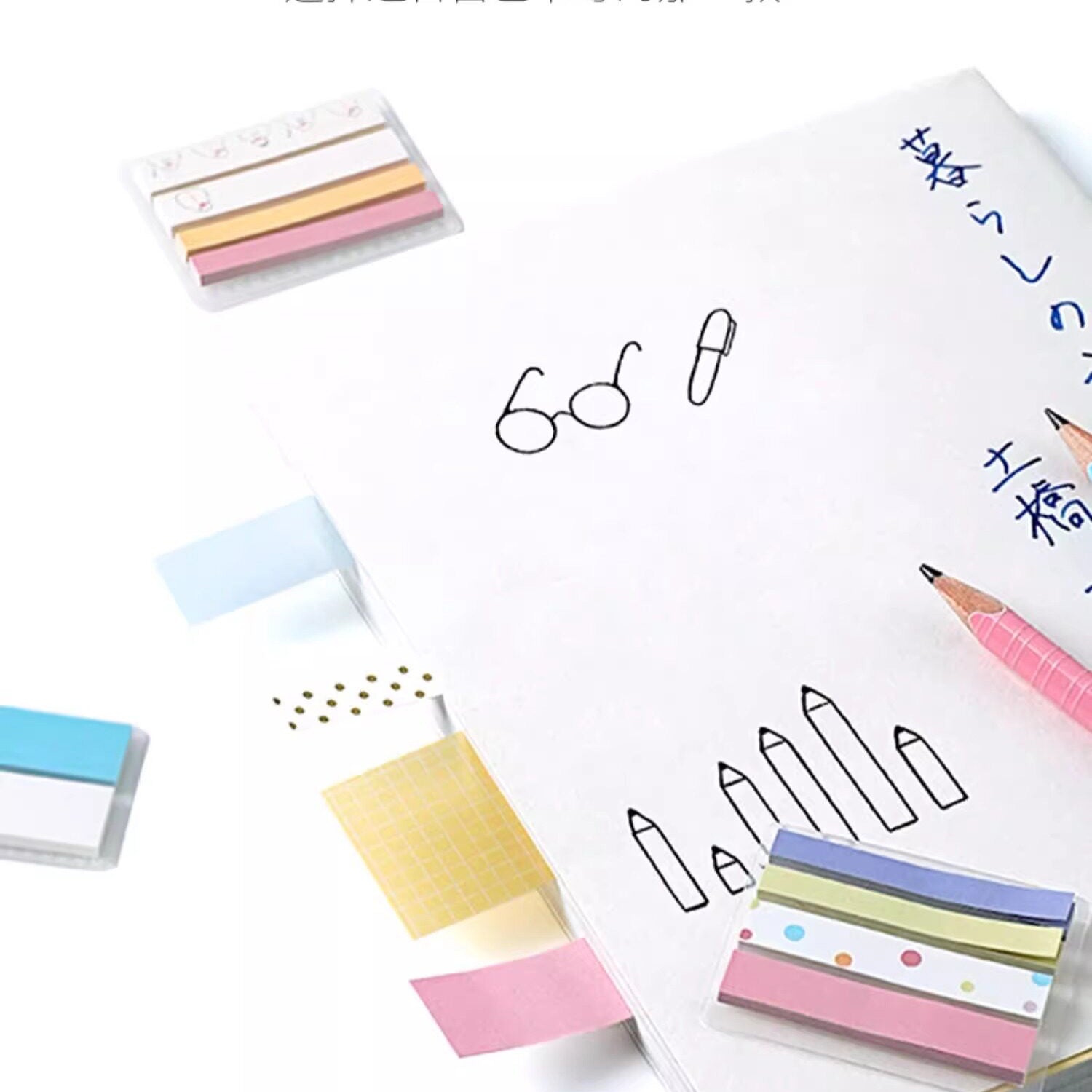 Four width options of KOKUYO Campus HALCO sticky notes laid beside a hand-drawn notebook page