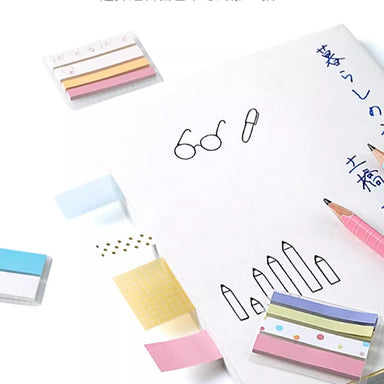 Four width options of KOKUYO Campus HALCO sticky notes laid beside a hand-drawn notebook page