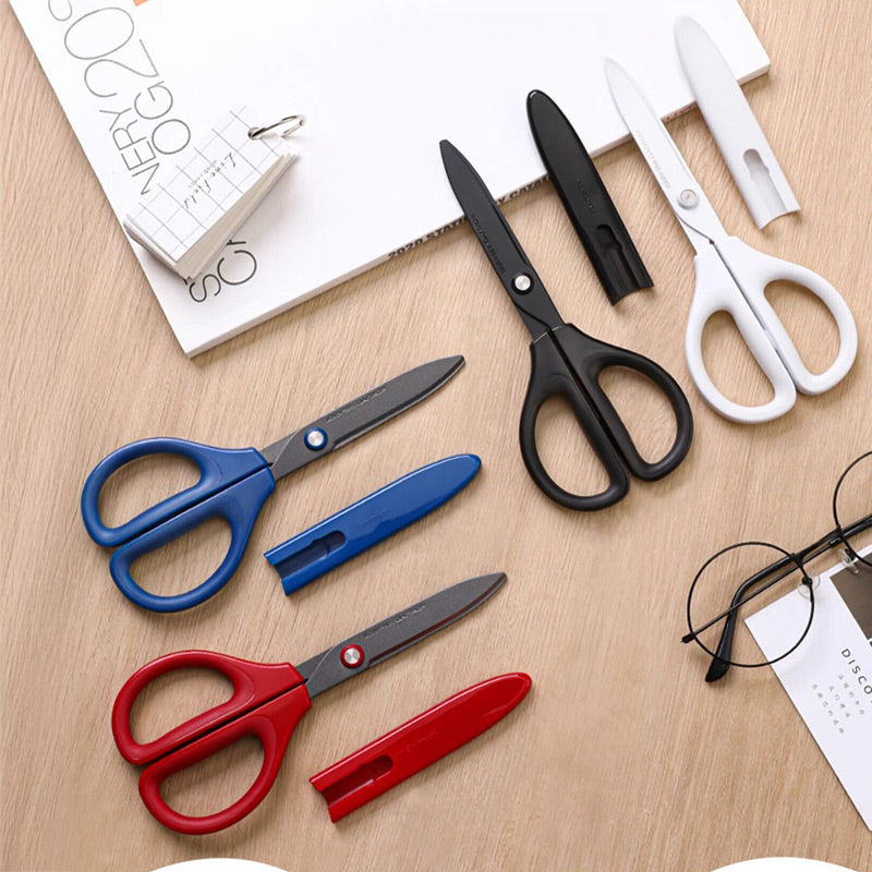 KOKUYO SAXA fluorine-coated scissors in red, blue and white are displayed together.