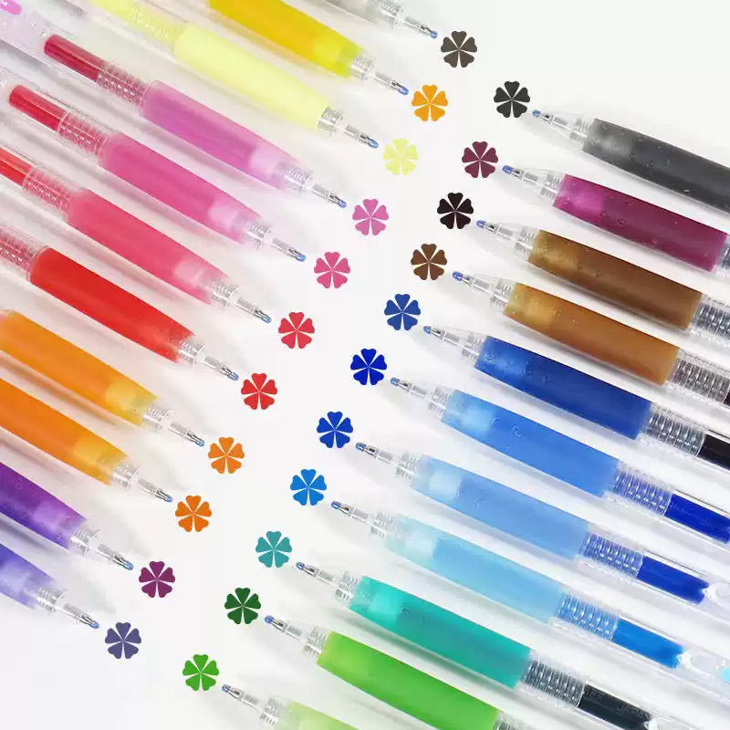 Pink-toned gel pens fanned out with flower doodles on notebook paper
