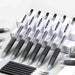 PILOT Juice gel pens and refills in black are arranged in a group.