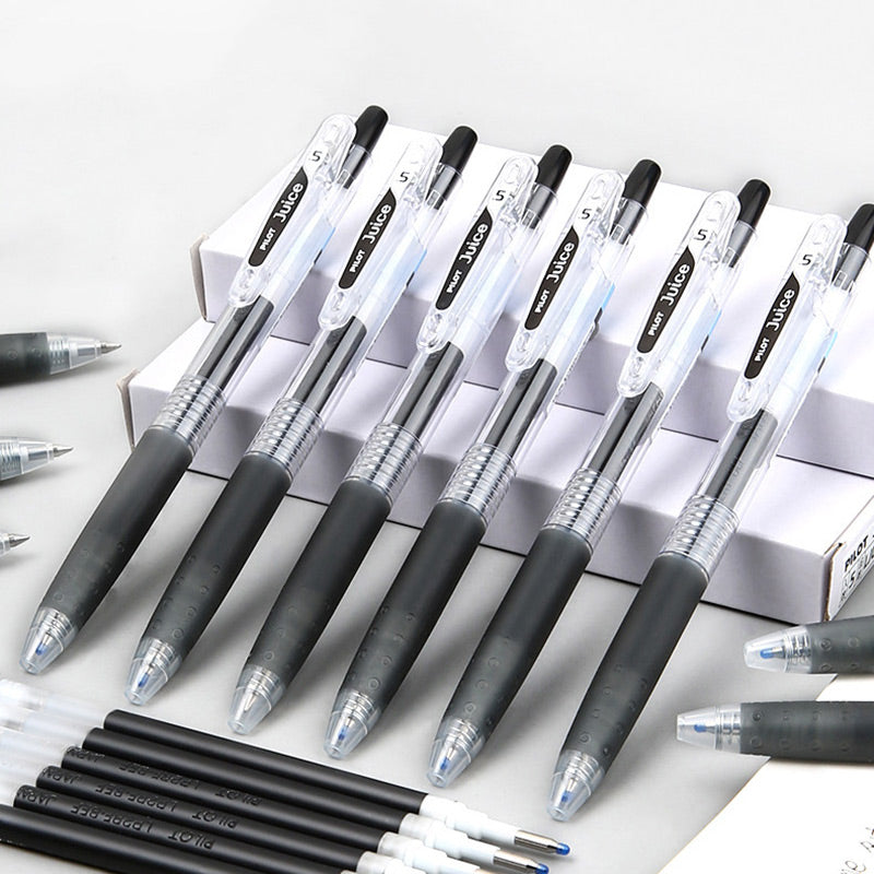 PILOT Juice gel pens and refills in black are arranged in a group.