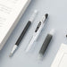 A PILOT Juice gel pen is shown with its barrel separated from the refill.
