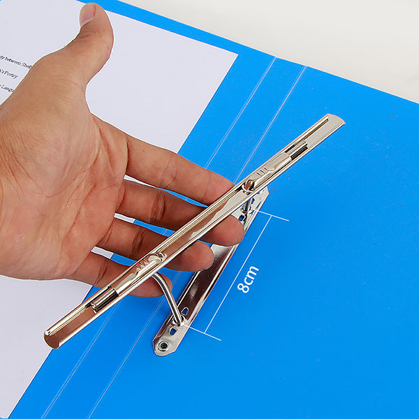 Hand lifts silver spring bar above blue folder base plate marked 8 cm between posts.