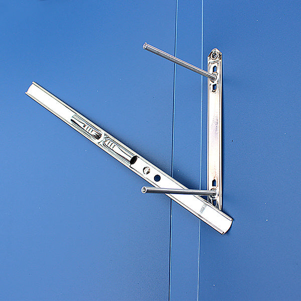 Close-up of silver spring posts and compressor bar on textured blue folder panel.