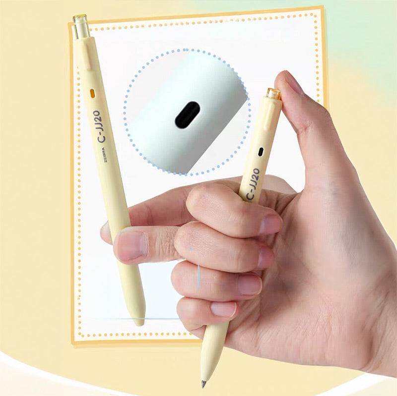 Hand clicking a yellow C-JJ20 pen with a close-up of the side window that turns black when the tip is out