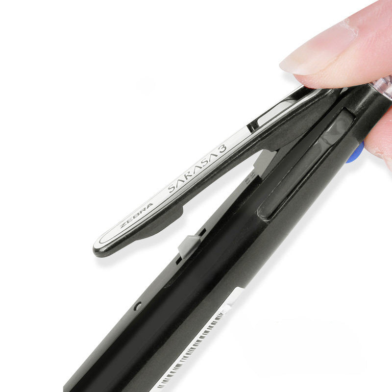 Black multi pen with its wide-angle clip lifted away from the barrel, held between two fingers