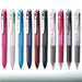 Ten 3-color gel ink multi pens in pink, white, sky blue, navy, red, black and clear barrels in a row