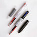 Hand holding a clear multi pen above an opened barrel showing three gel ink refills and a black cap
