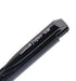 Close-up of the bevelled push button end of a black Signo RT1 0.38 pen