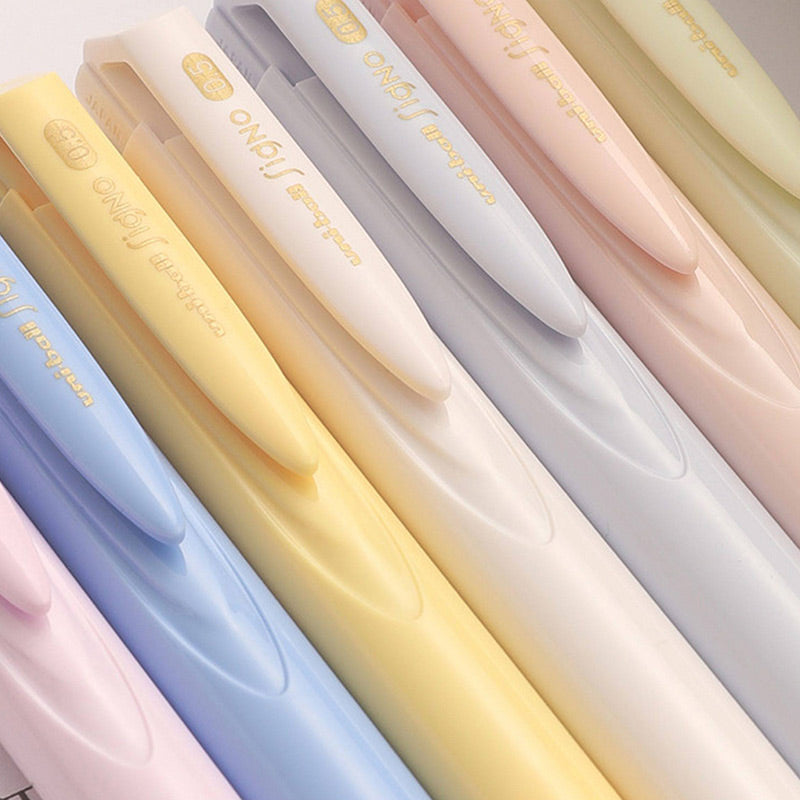 Close-up of pastel yellow, blue, ivory, gray and pink Signo RT1 pens with a low-drag tip illustration